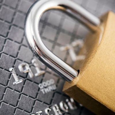 A credit card with a lock in front of it